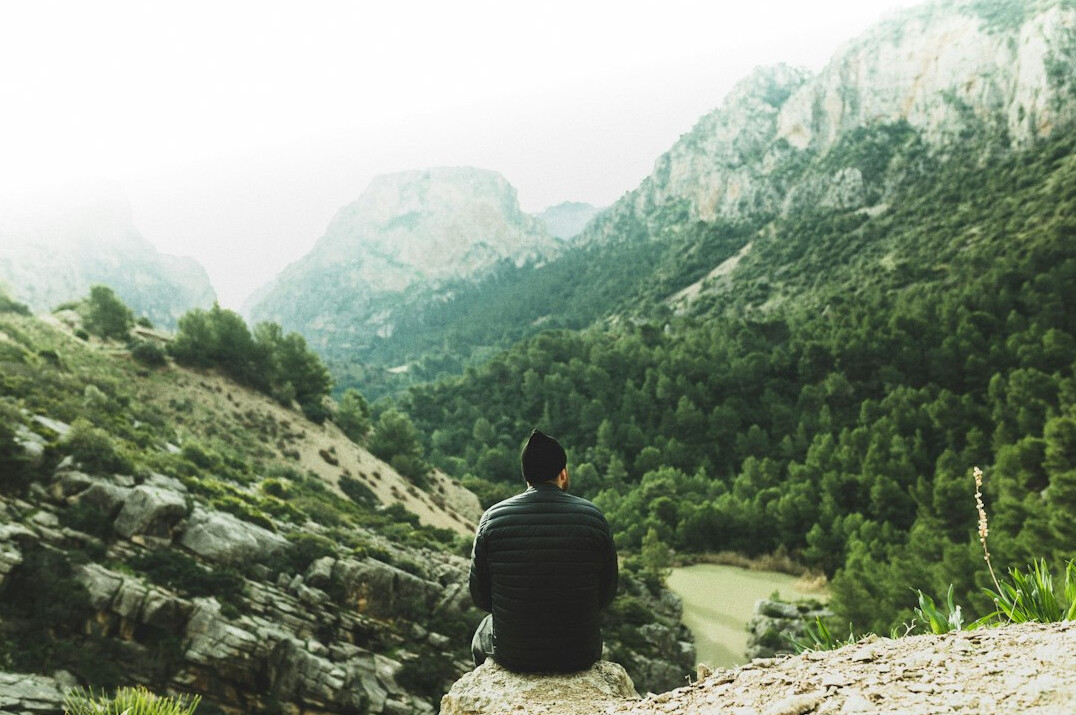 person meditating in nature
