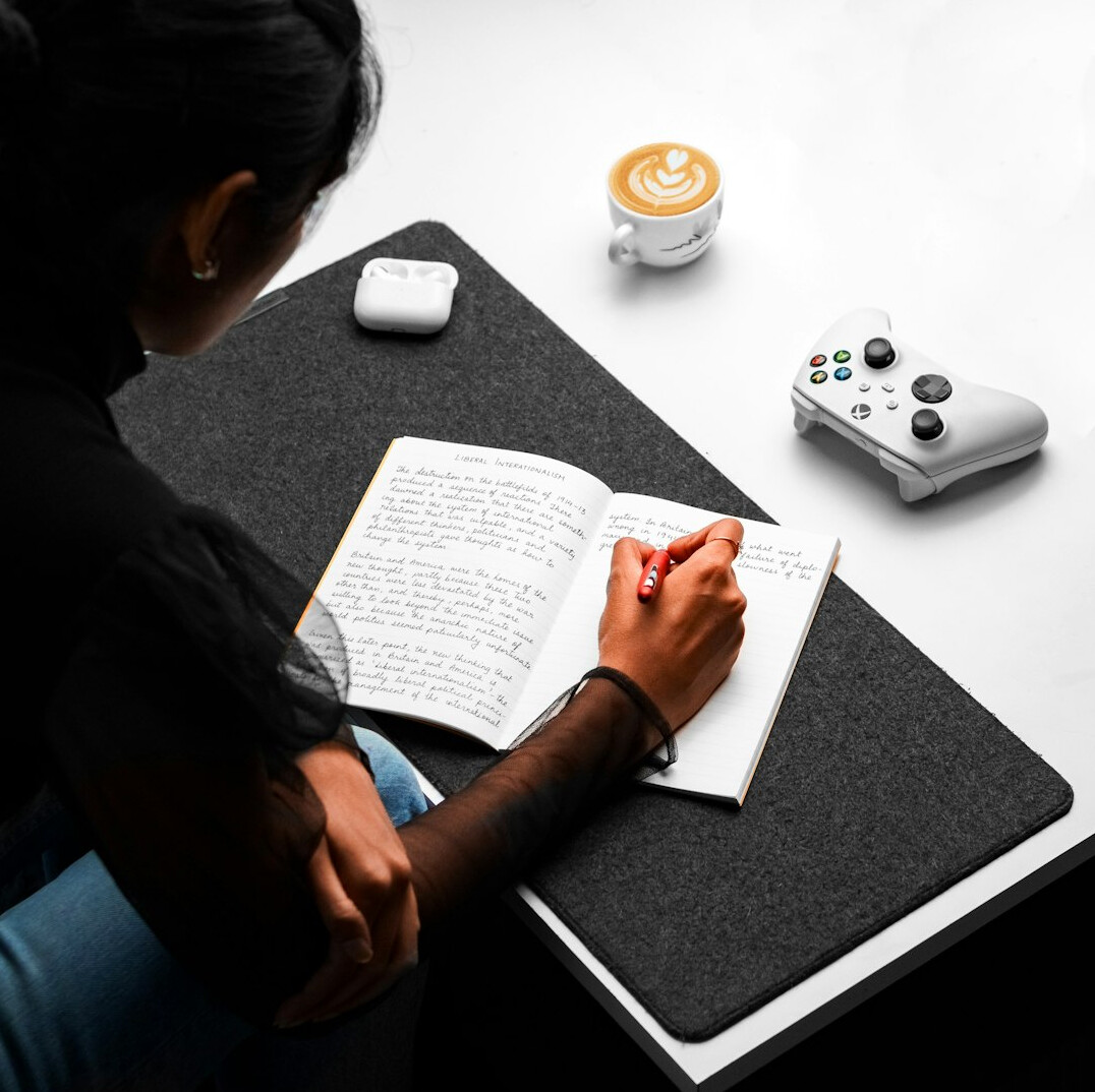 person journaling at desk