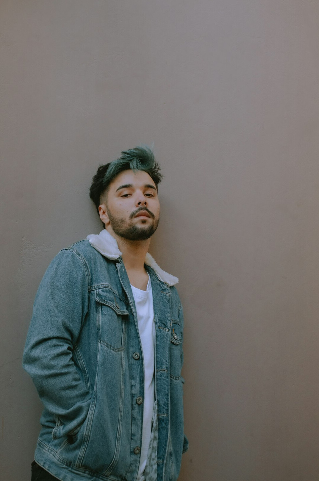 Brazilian man with beard smiling in a relaxed pose