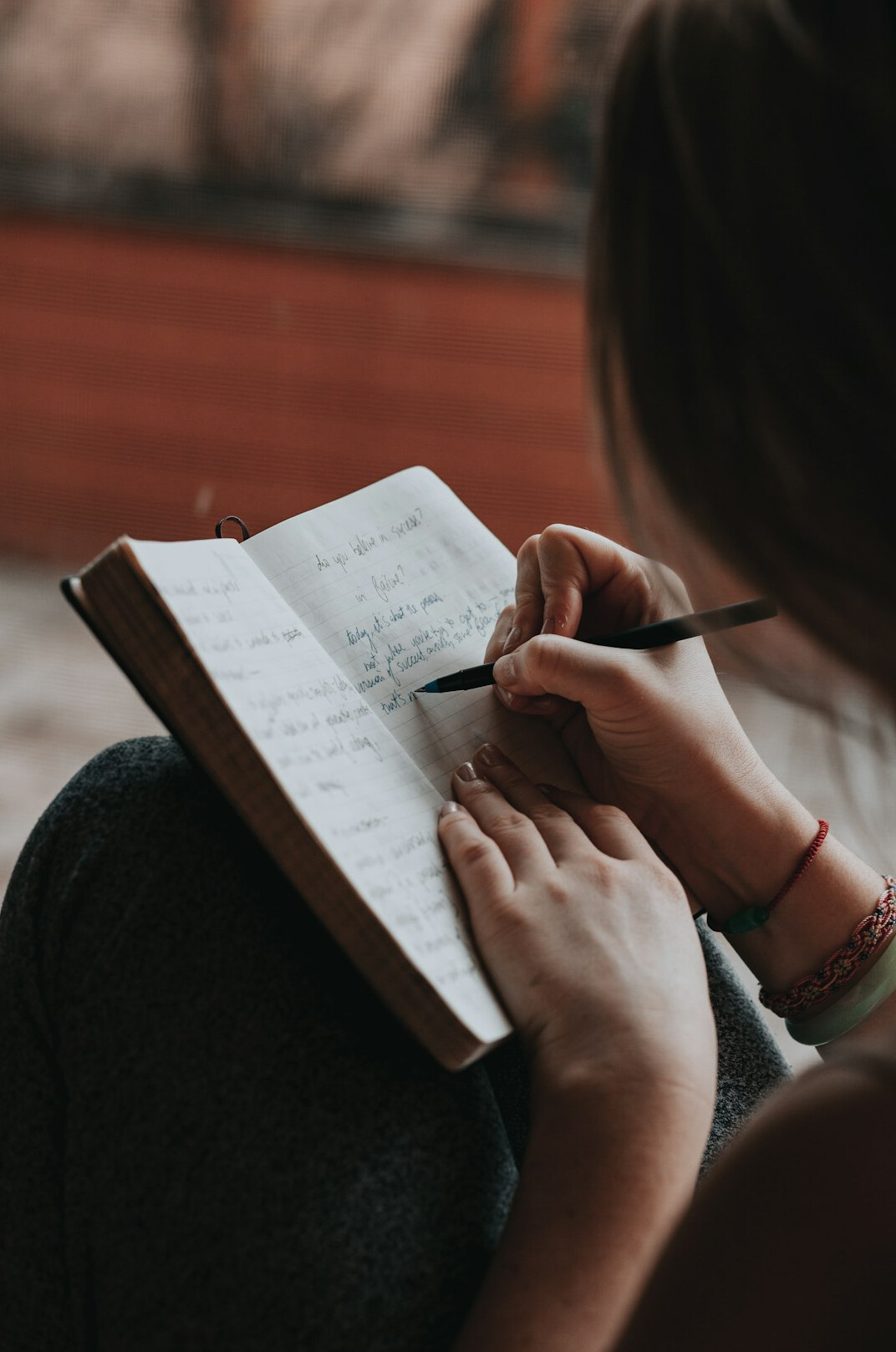 woman writing in journal